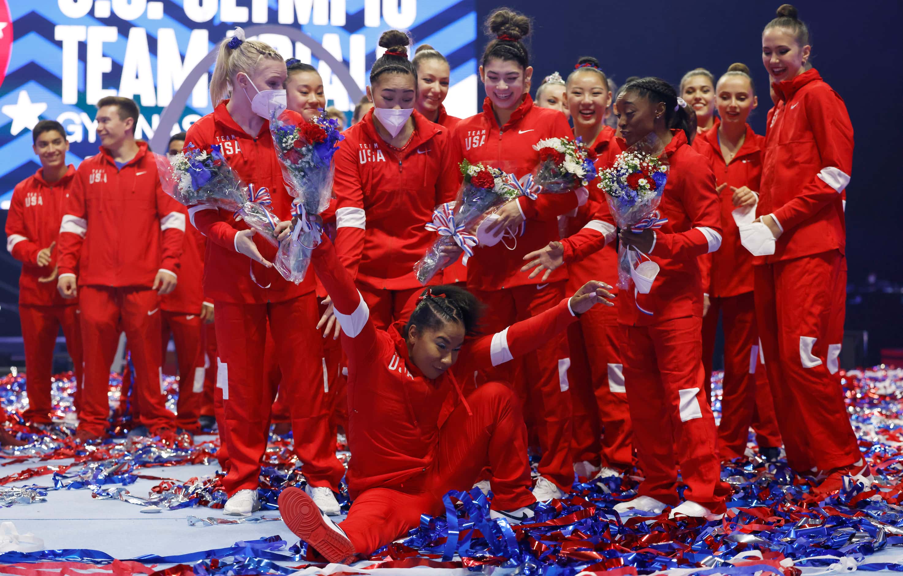 Jordan Chiles falls rushing to get into a group photo after the women's U.S. Olympic...