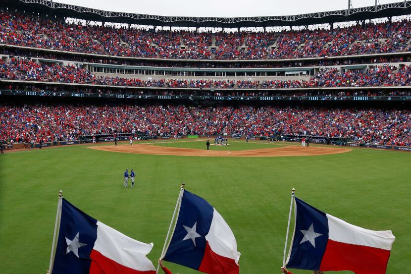 The Texas flags are unfurled on Greene's Hill after a Rangers run during the Toronto Blue...