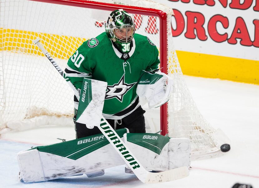 Dallas Stars goaltender Ben Bishop (30) makes a save on a shot by the Buffalo Sabres' Henri...