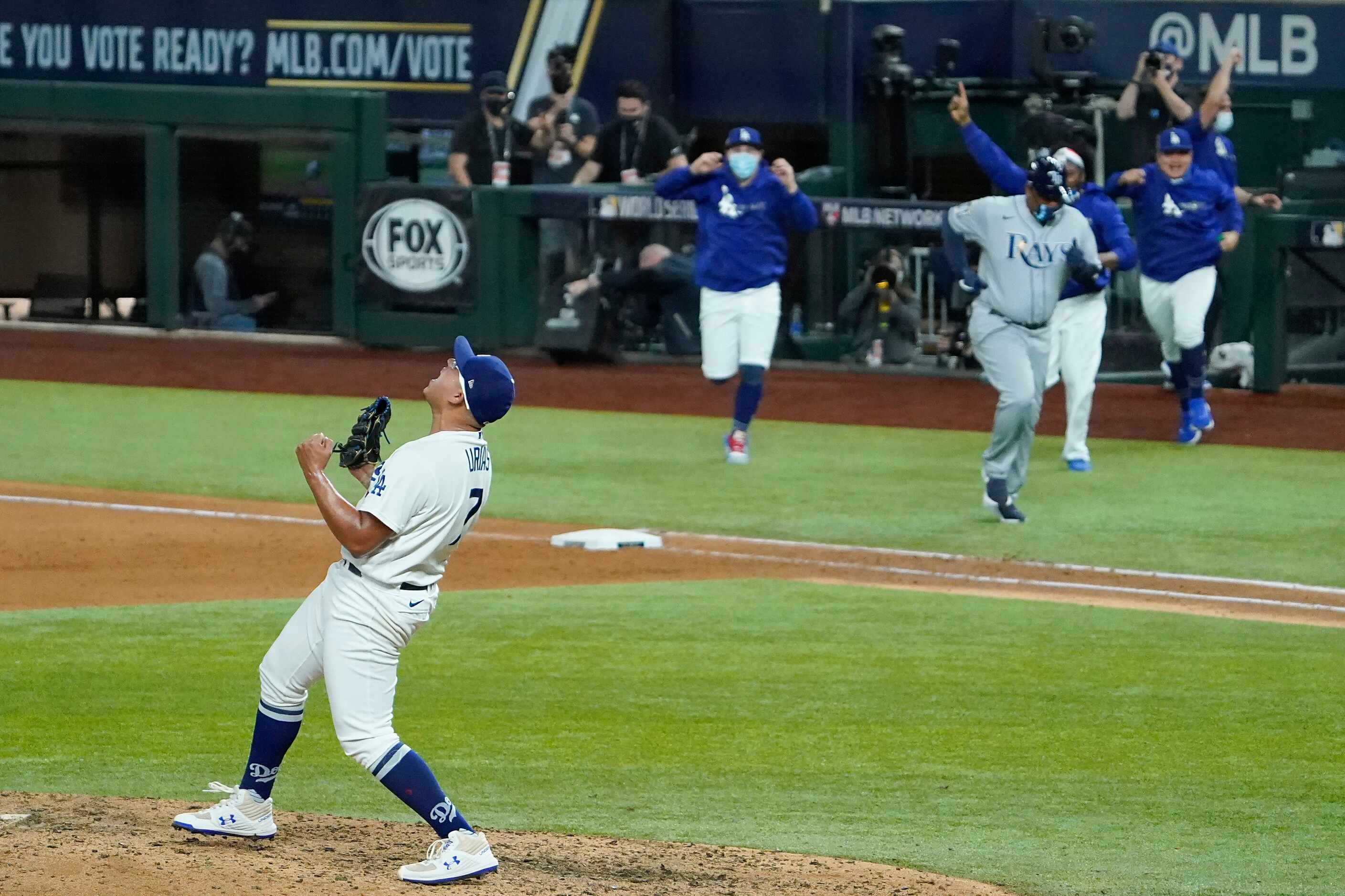 Los Angeles Dodgers pitcher Julio Urias celebrates the final after defeating the Tampa Bay...