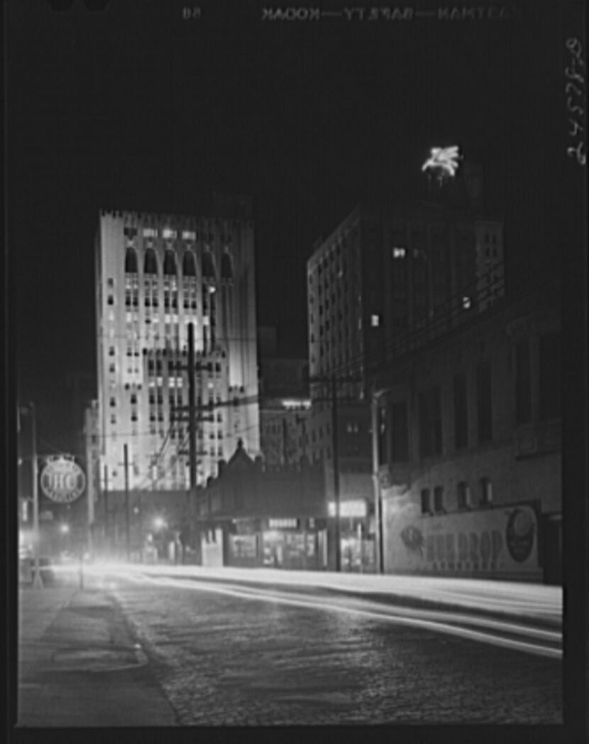 Downtown Dallas at night in January 1942. The Magnolia Oil Company building is in view.
