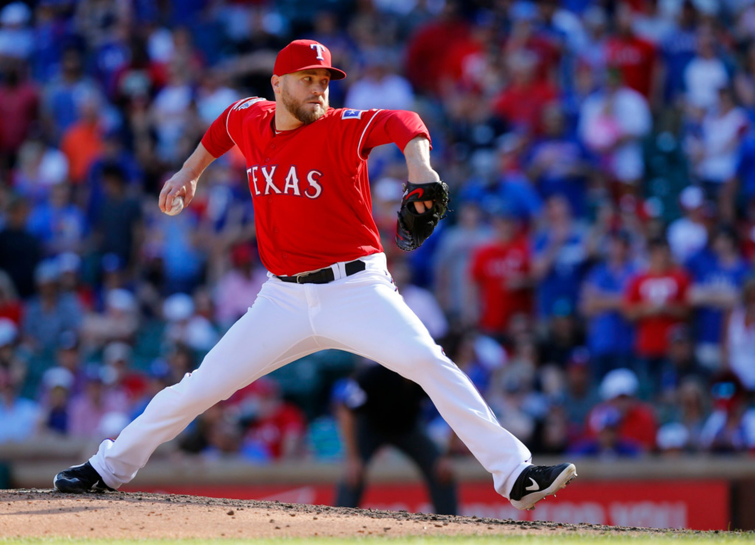 Texas Rangers relief pitcher Shawn Kelley throws in the ninth inning before getting the save...