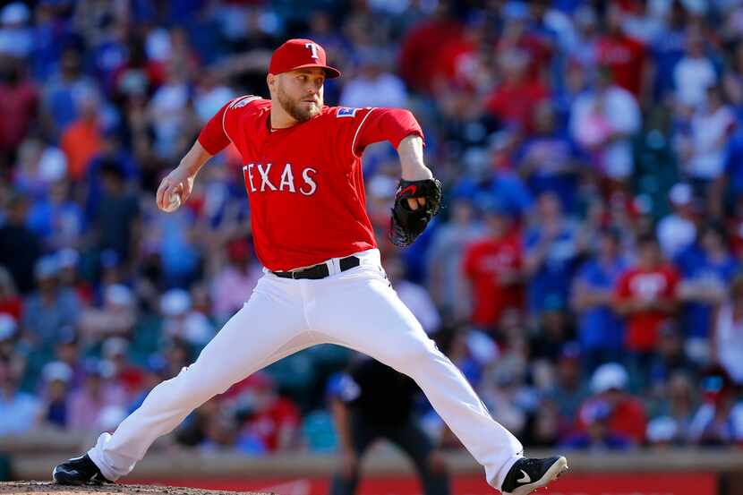 Texas Rangers relief pitcher Shawn Kelley throws in the ninth inning before getting the save...