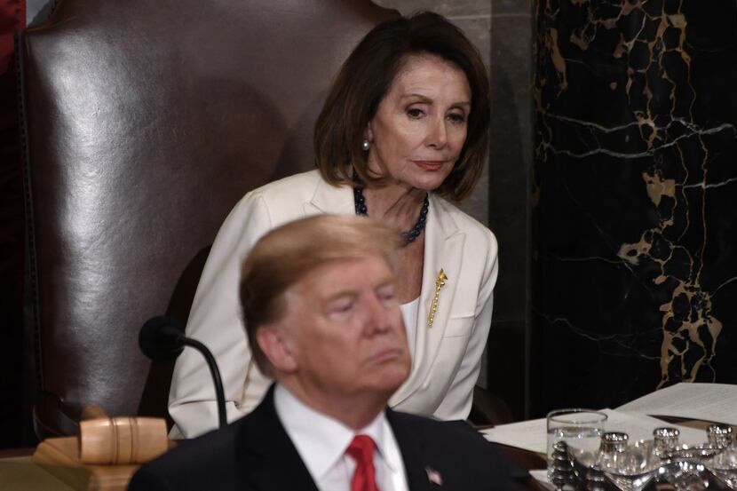 House Speaker Nancy Pelosi listens to President Donald Trump during the State of the Union...