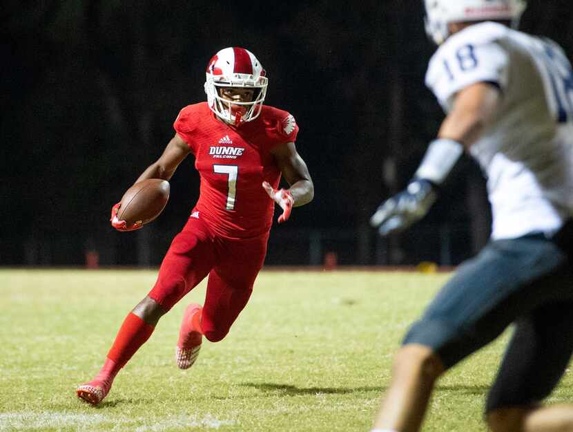 Bishop Dunne senior wide receiver Jabari Khepera (7) turns upfield after making a catch in...