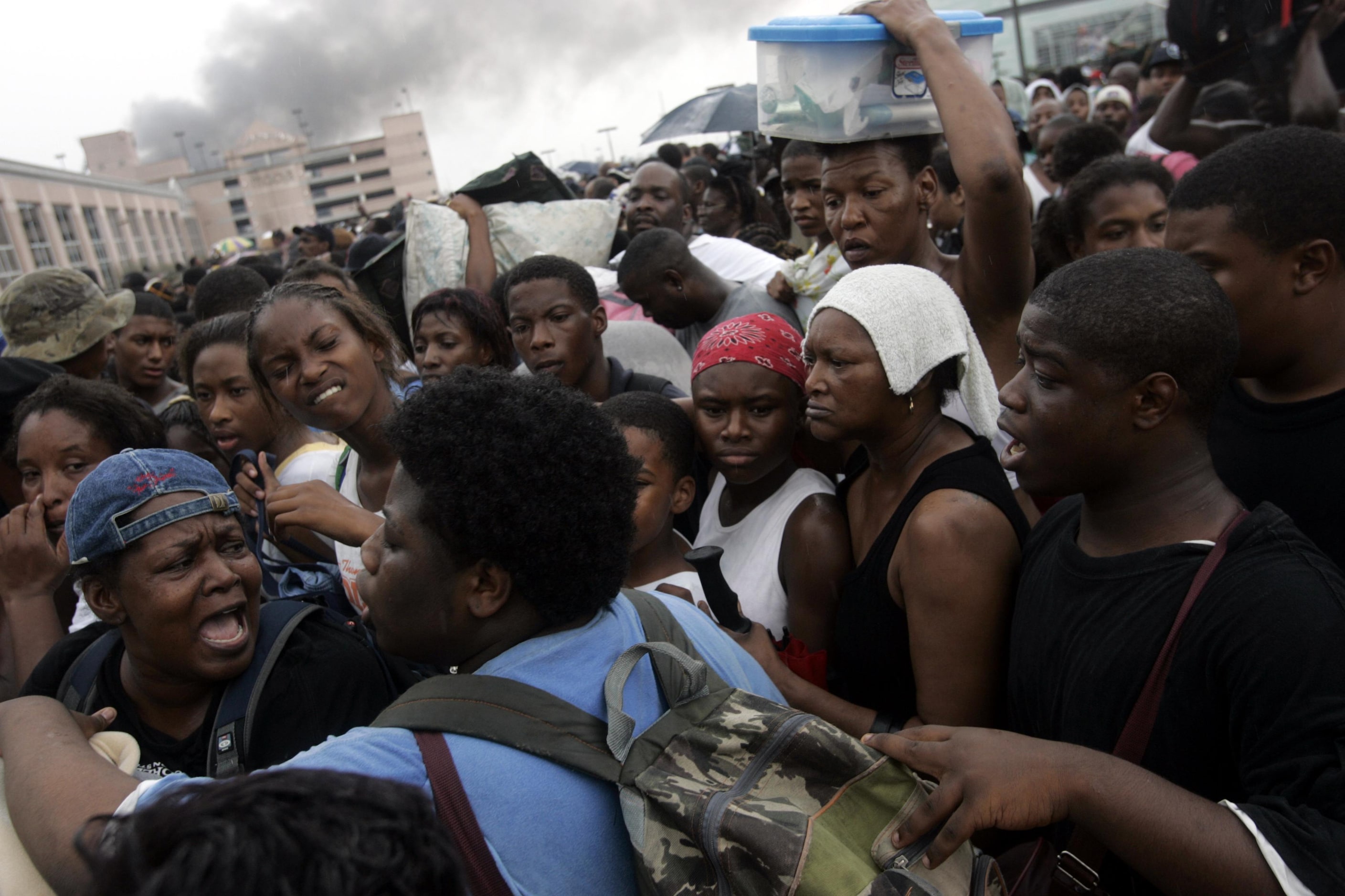 Evacuees at the Superdome argued in the tangled line for a bus trip to the Houston...