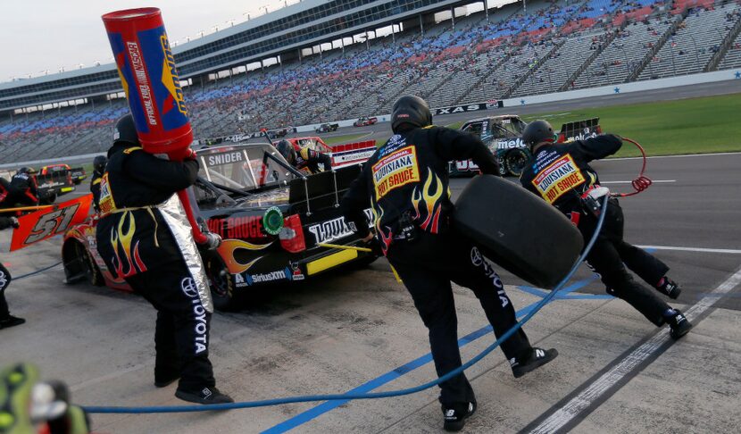 Crew members of Myatt Snider work in the pit during the winstaronlinegaming.com 400 NASCAR...