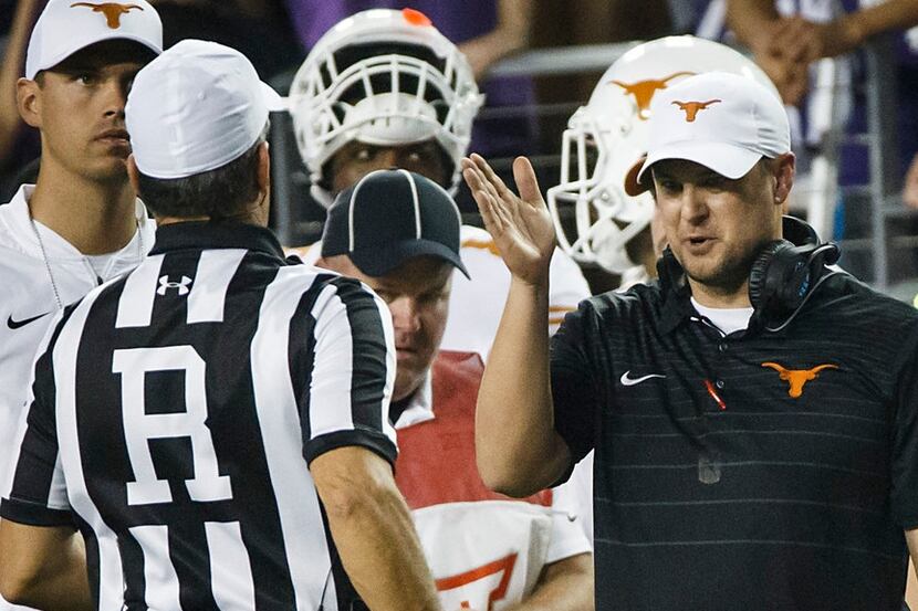Texas head coach Tom Herman argues with referee Brad Van Vark during the second half of an...
