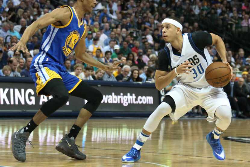 Dallas Mavericks guard Seth Curry (30) is guarded by Golden State Warriors guard Patrick...
