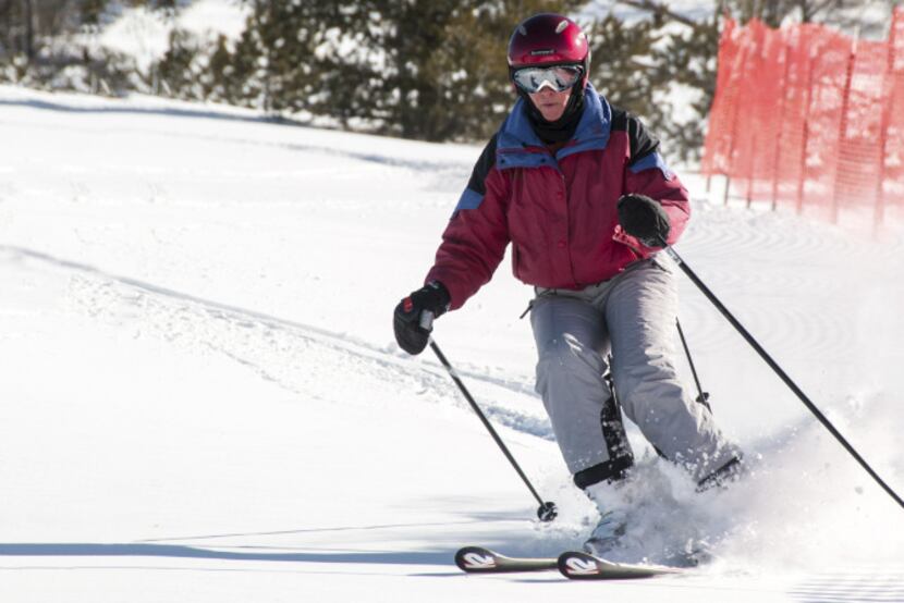 A CADS-clad skier descends a bump run on Aspen Mountain. At 50 degrees of knee flexion, CADS...