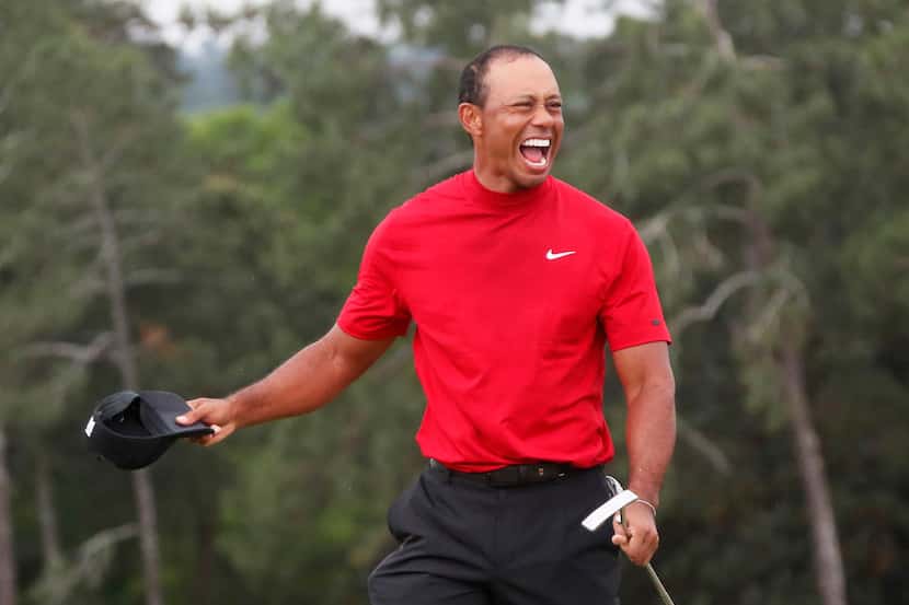 Tiger Woods celebrates after winning the Masters on Sunday, April 14, 2019, at Augusta...
