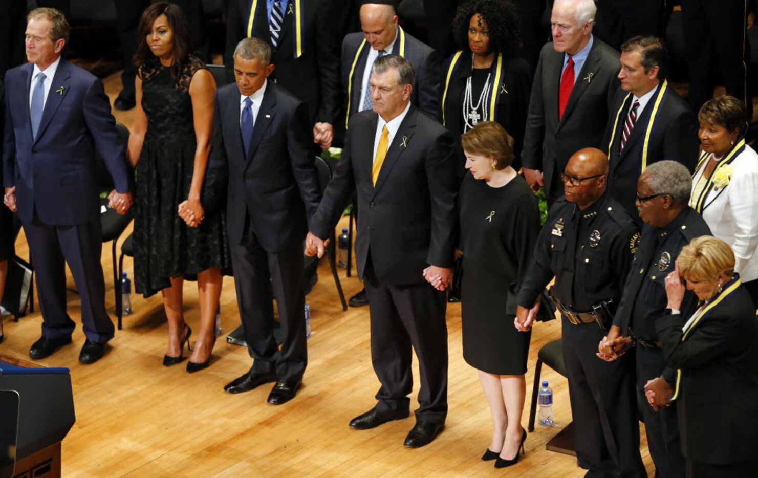 From left, former President George W. Bush, first lady Michelle Obama, President Barack...