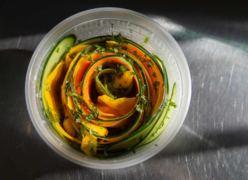 Ribbon salad with cucumber, mango, carrot, lime and herb sesame dressing 