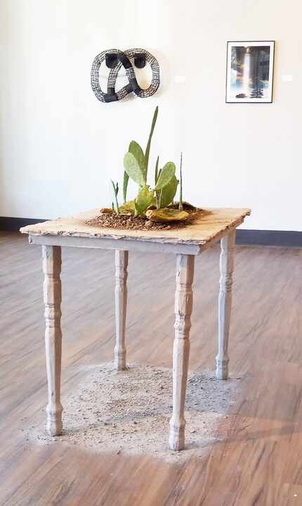 Karla García uses soil and cactus to reconstruct a desert landscape in "Vida." Her work is a...