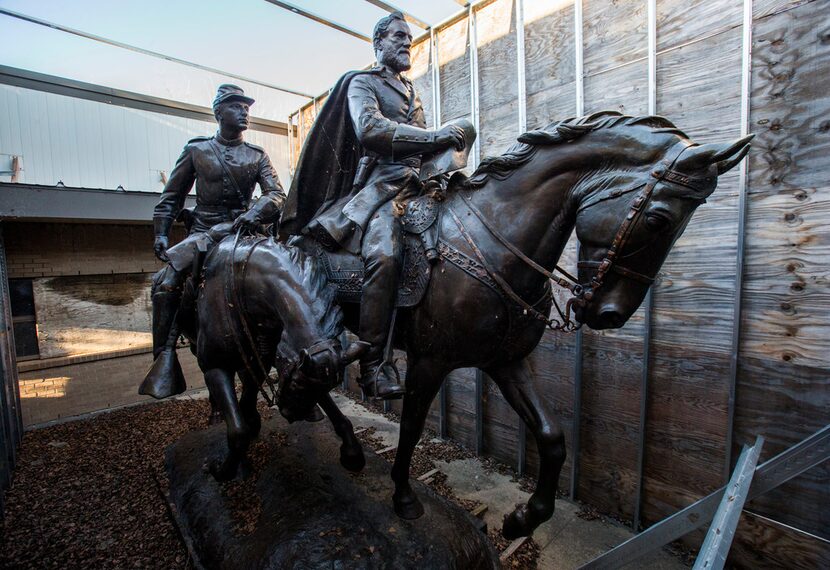 The 1935 statue of Robert E. Lee, right, and a young soldier by sculptor Alexander...