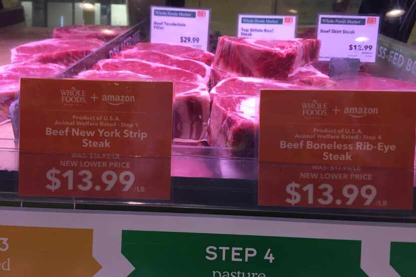 Whole Foods + Amazon price tag on New York strip and ribeye steaks at the Whole Foods Market...