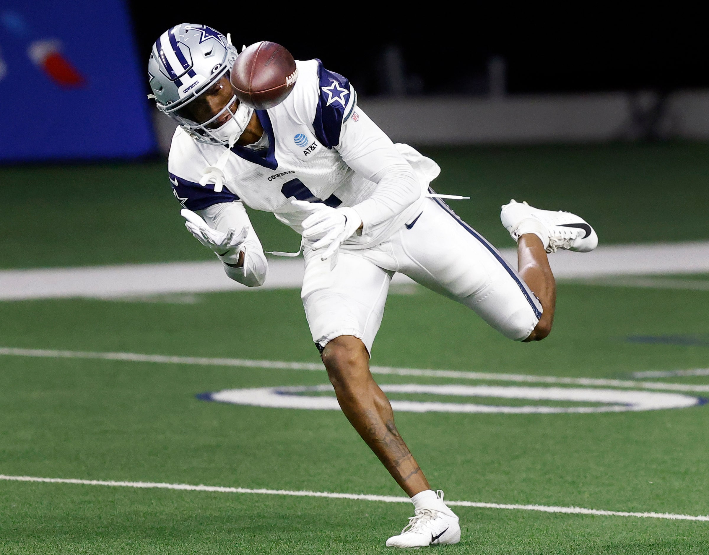 Dallas Cowboys wide receiver Cedrick Wilson (1) tries to corral a pass during Training Camp...