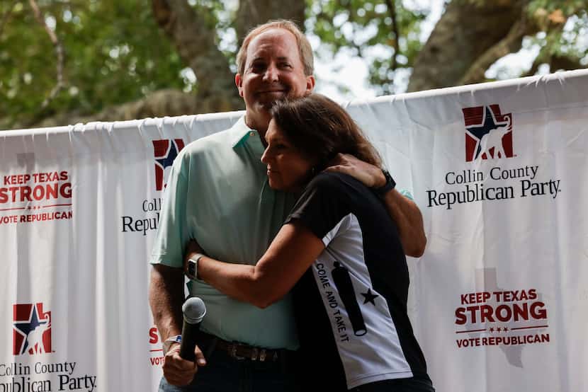 Texas Attorney General Ken Paxton hugs his wife, Sen. Angela Paxton, R-McKinney, before...