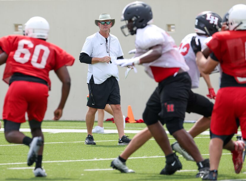 Lake Highlands High School head football coach Lonnie Jordan watches his players run through...