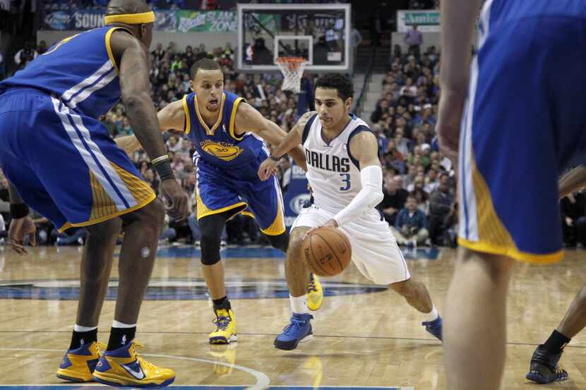 Dallas Mavericks point guard Shane Larkin (3) drives the lane against the Golden State...