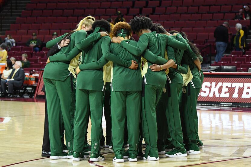 Baylor players huddle together before an NCAA college basketball game against Oklahoma in...