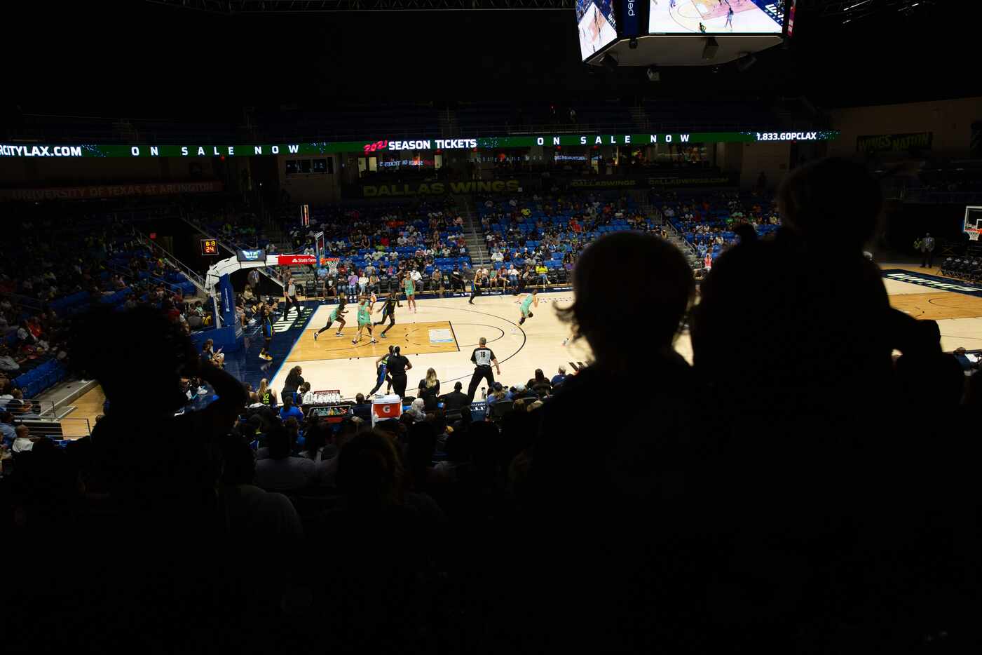 Fans watch the Dallas Wings game against New York Liberty at College Park Center in...