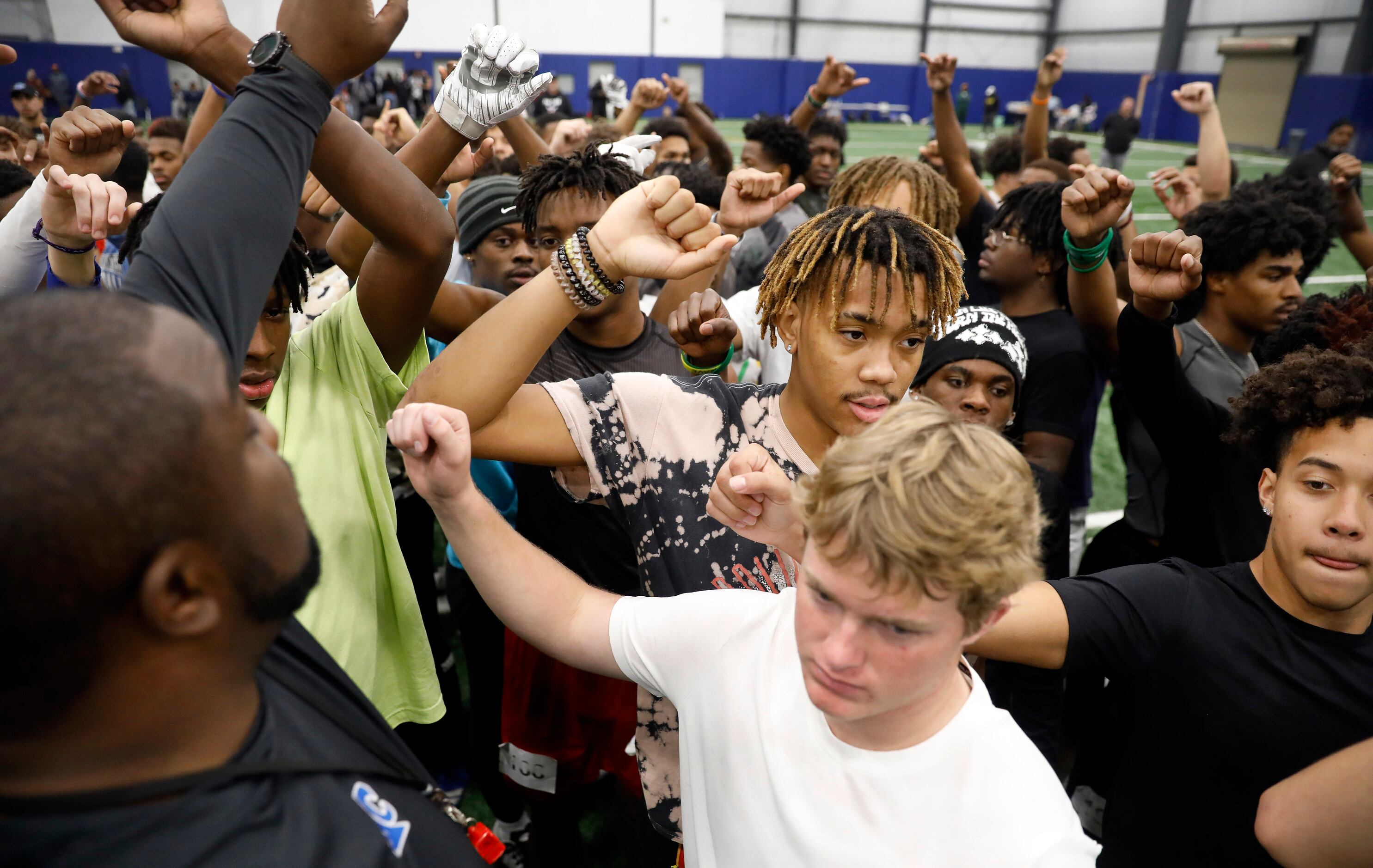 North Crowley High School head football coach Ray Gates (left) gathered unsigned senior...