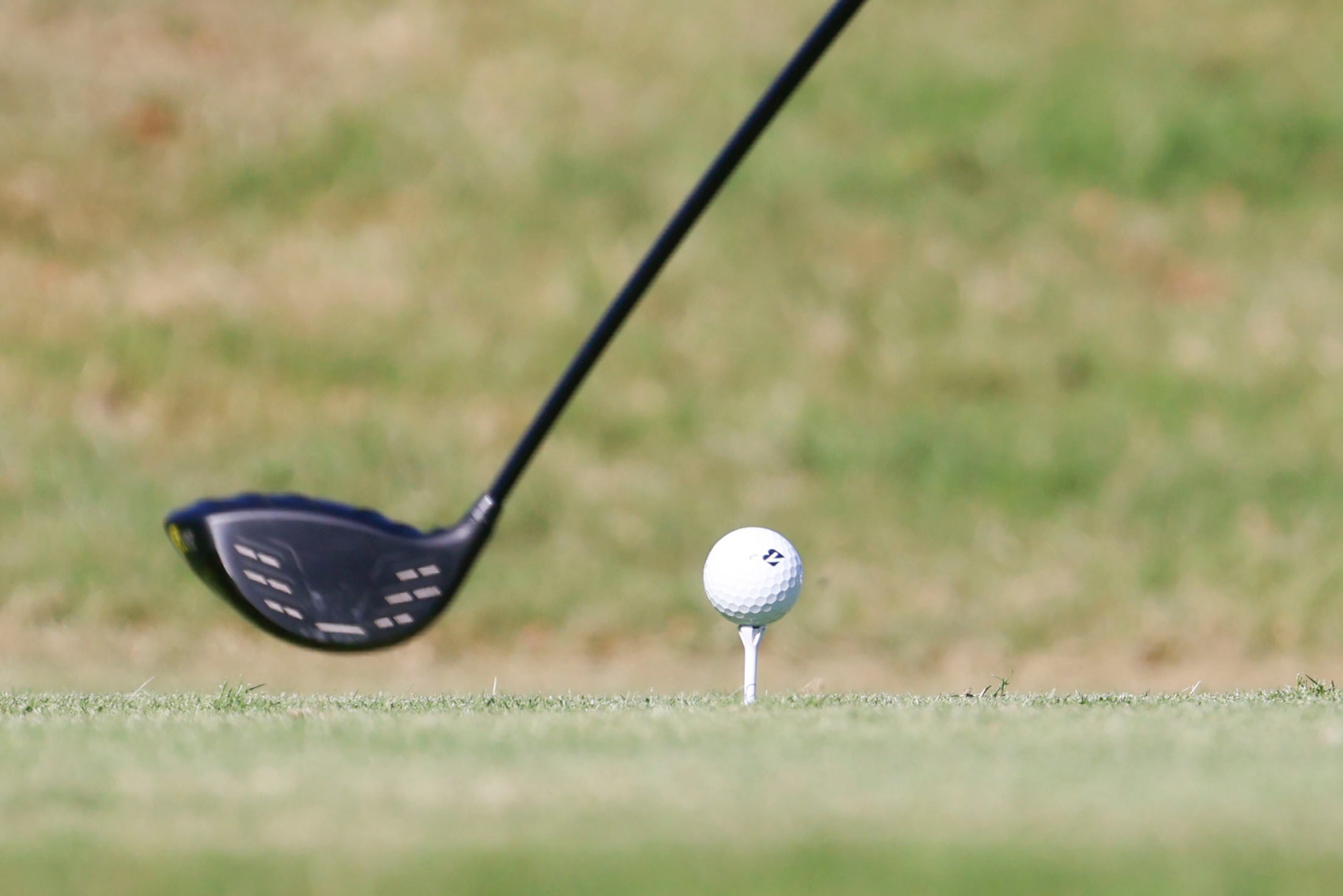 Golfers tee off during the Southwest Airlines Showcase amateur golf tournament, on...