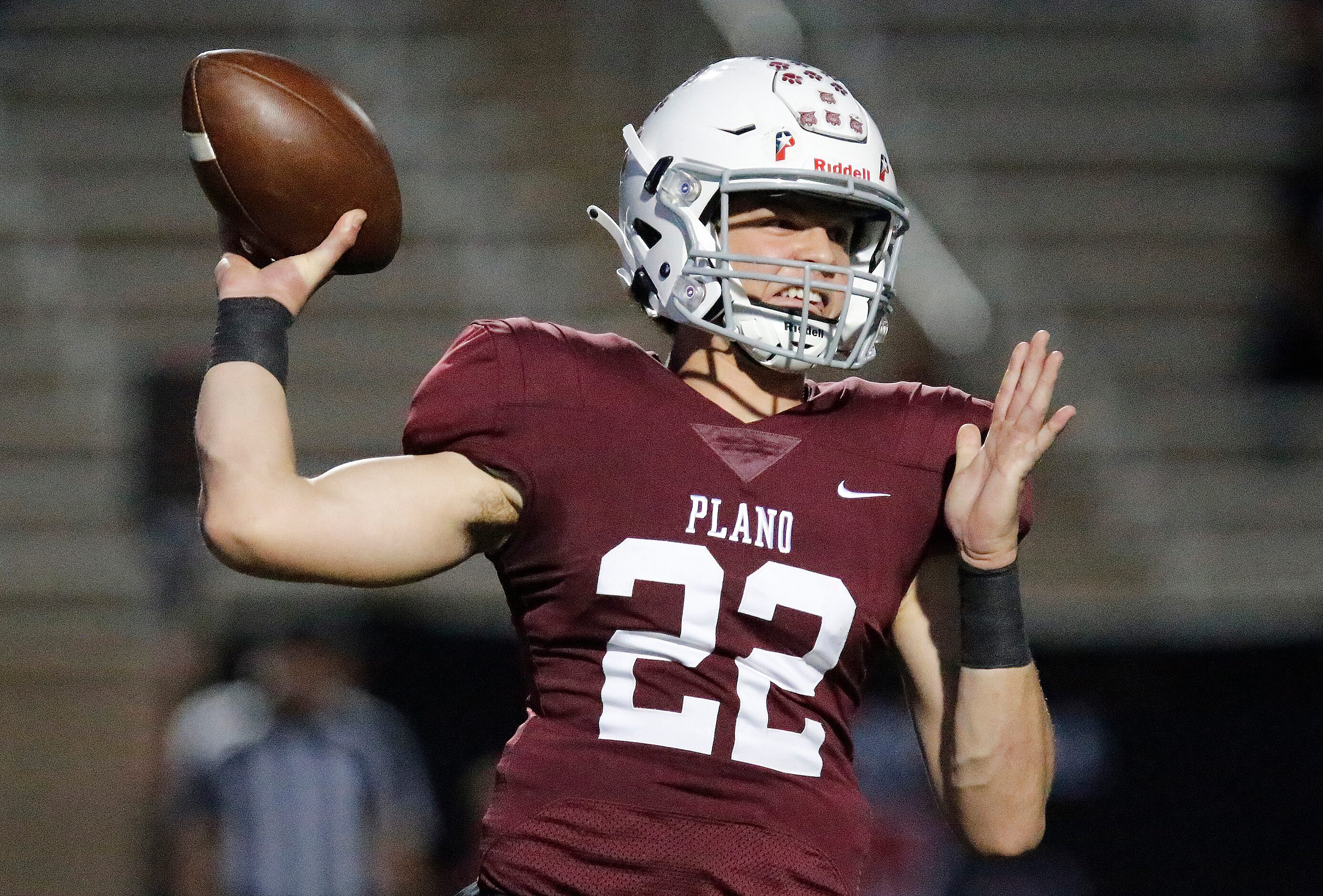 Plano Senior High School quarterback Drew Forkner (22) throws a pass during the first half...