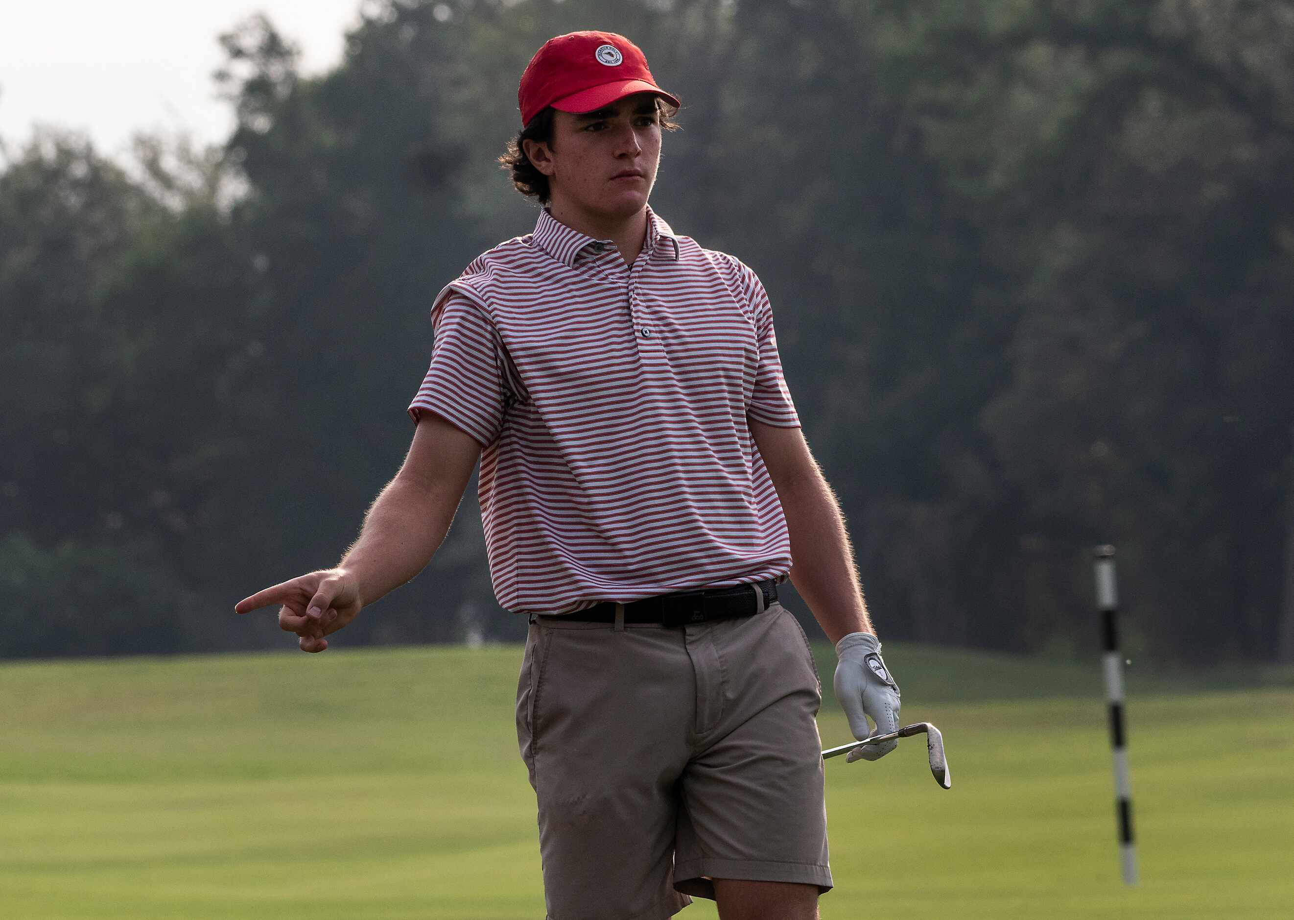 Flower Mound Marcus, Algya Trevor, talks to his shot on the no.1 fairway during the first...