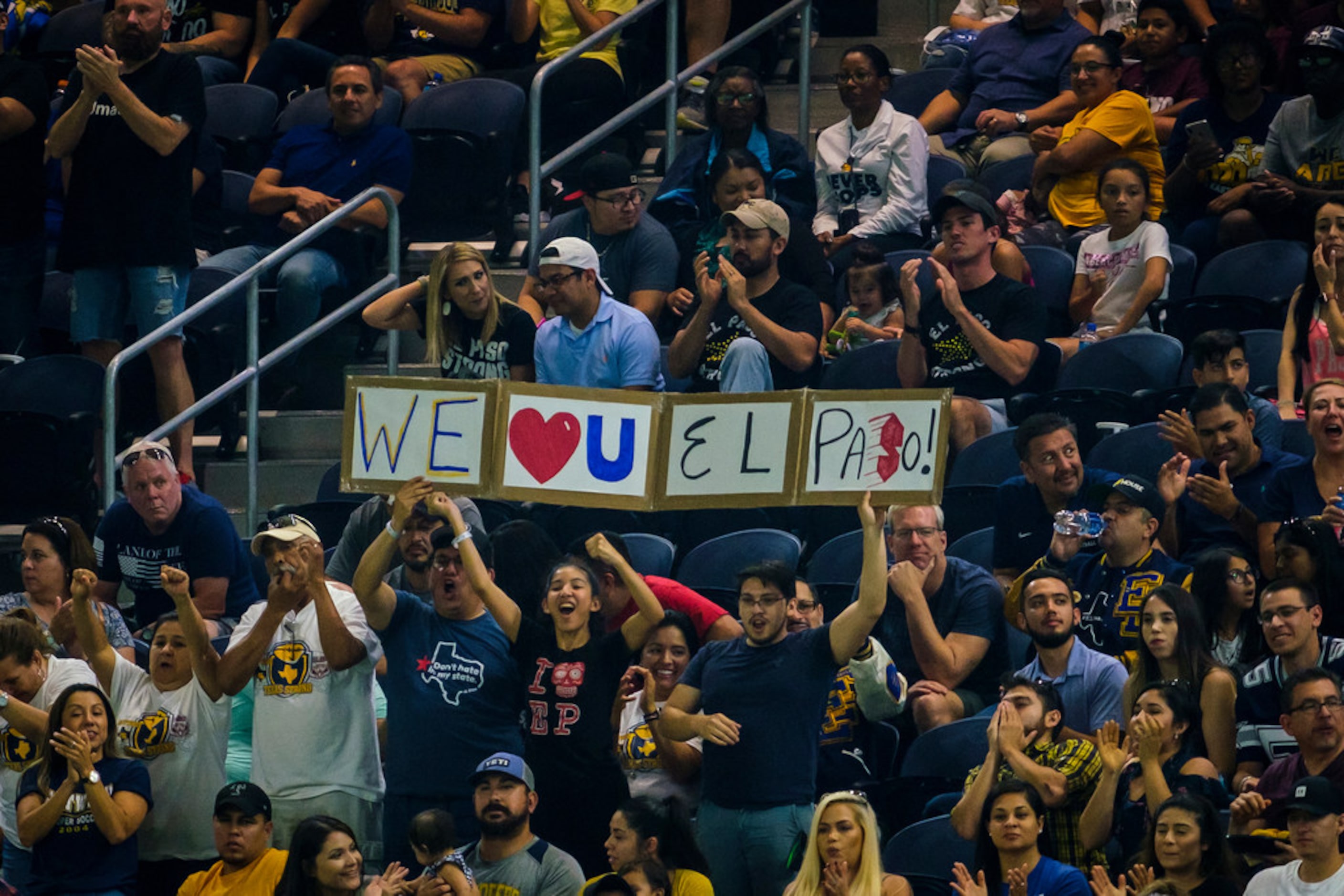 El Paso Eastwood fans cheer their team during the second half of high school football game...