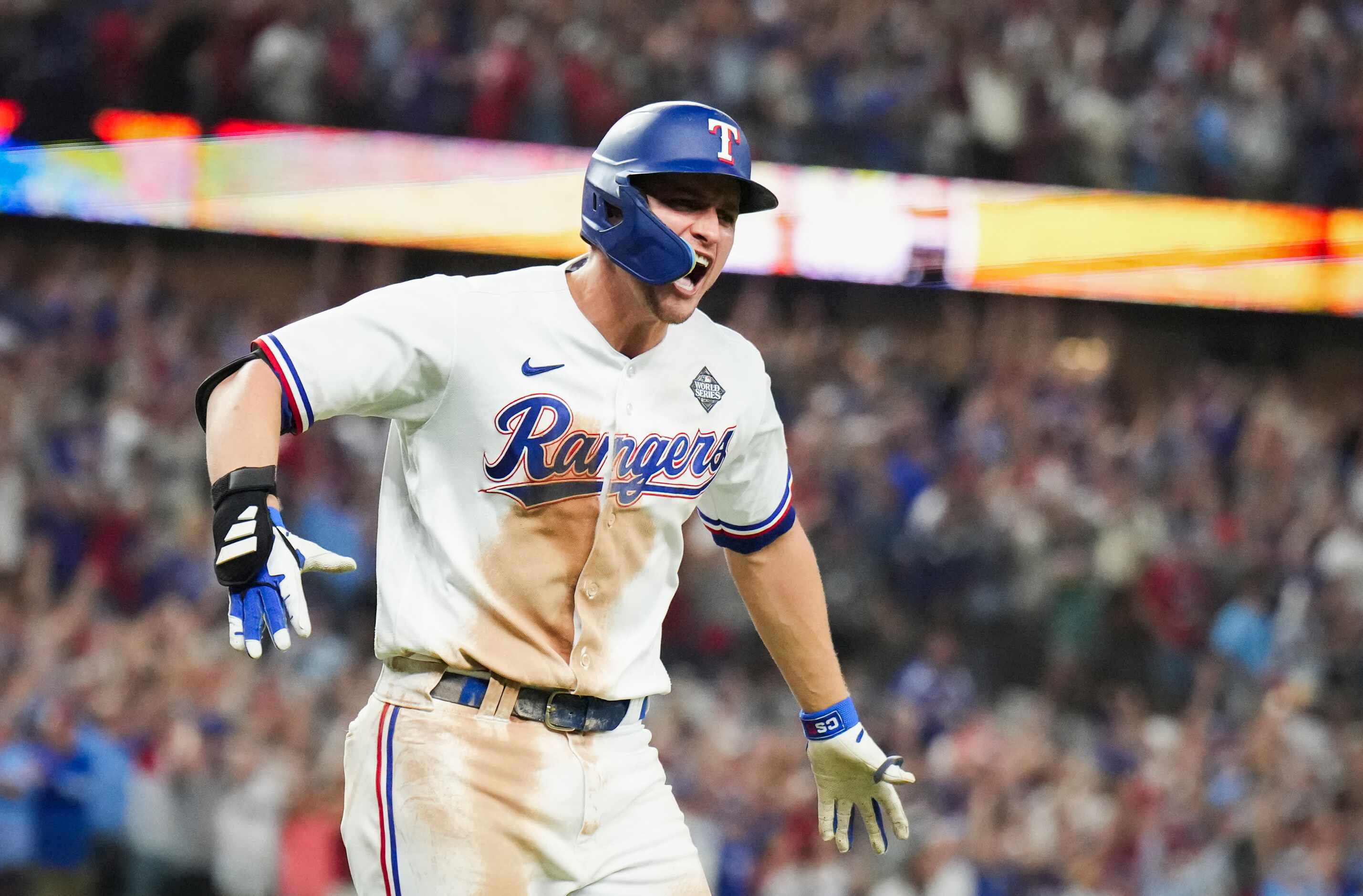 Texas Rangers' Corey Seager celebrates after hitting a two-run home run to tie the game...