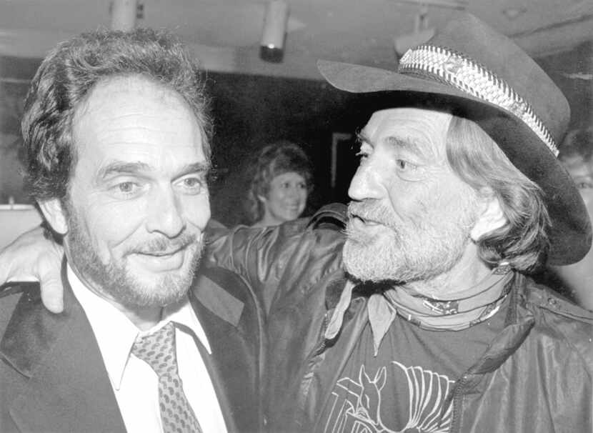 Merle Haggard (left) and Willie Nelson attend the BMI awards dinner in Nashville in Oct....