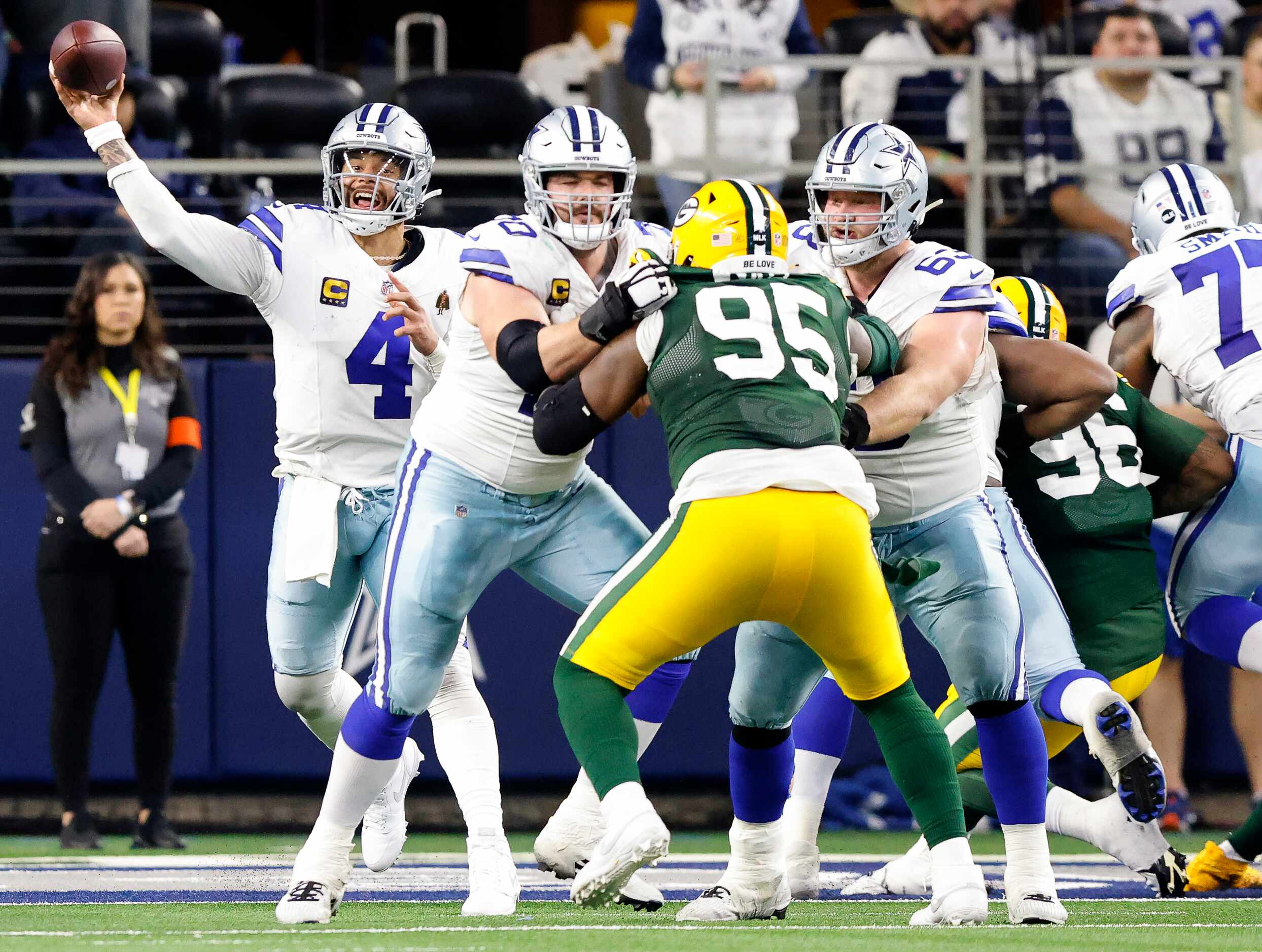 Dallas Cowboys quarterback Dak Prescott (4) throws a fourth quarter pass near the end zone...