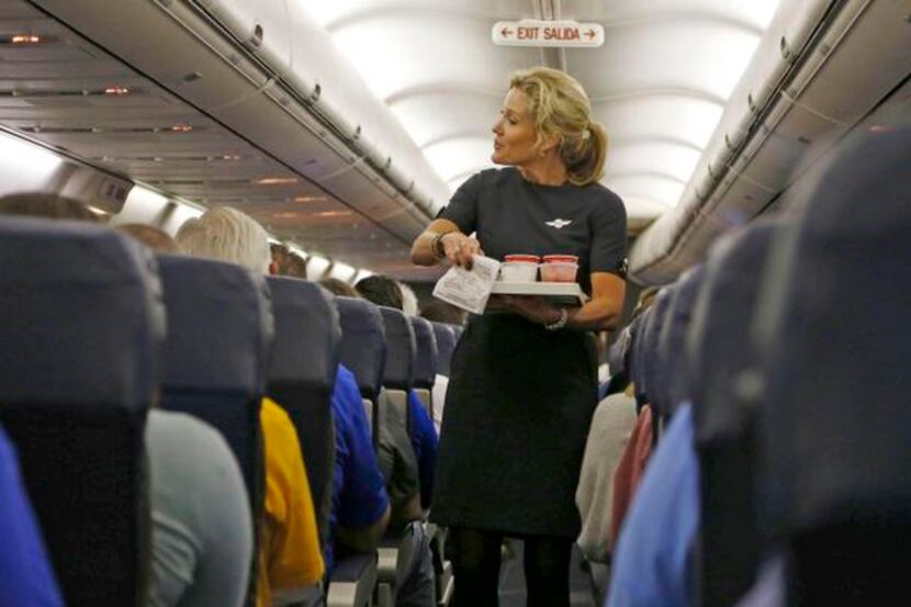 
Flight attendant Jenni Heikkinen handed out drinks on Southwest Airlines Flight 1013 to...