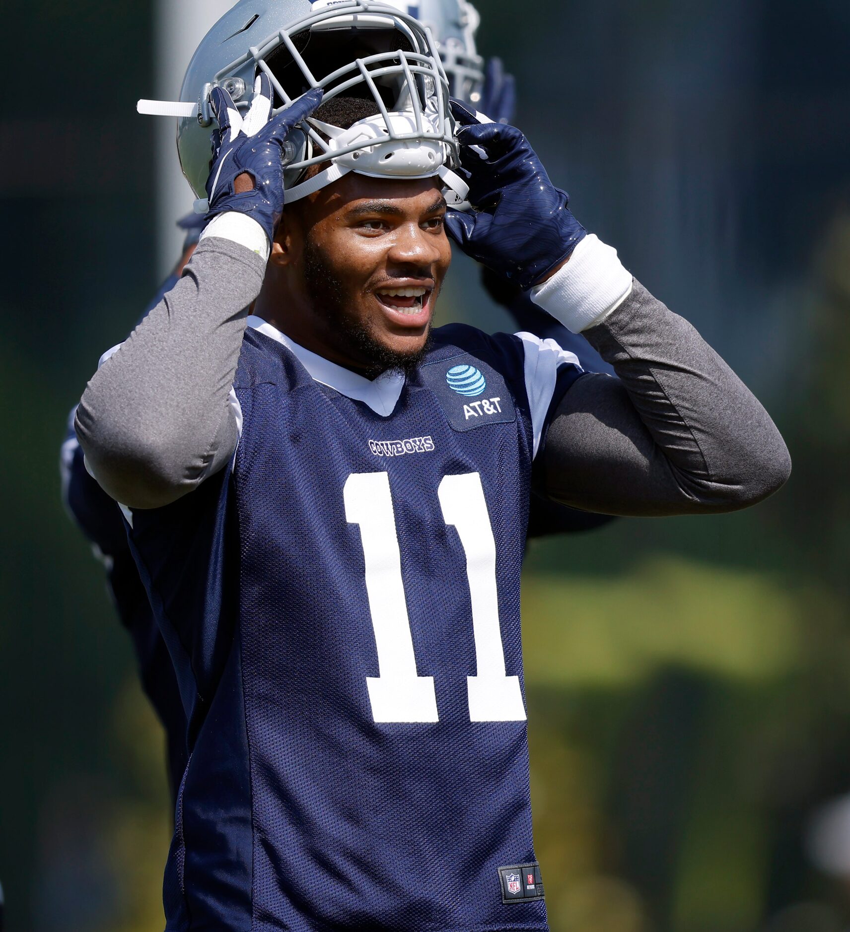 Dallas Cowboys first round linebacker Micah Parsons (11) laughs with teammates during rookie...