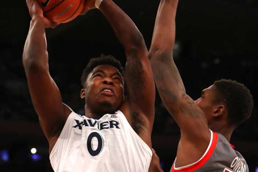 NEW YORK, NY - MARCH 08:  Tyrique Jones #0 of the Xavier Musketeers drives to the basket...