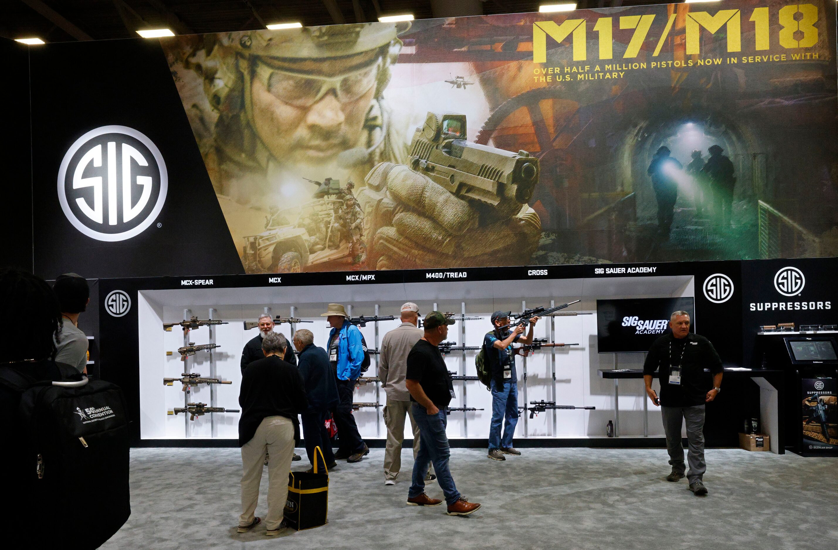 Visitors walk around during 2024 NRA Annual Meetings & Exhibits at Kay Bailey Hutchison...