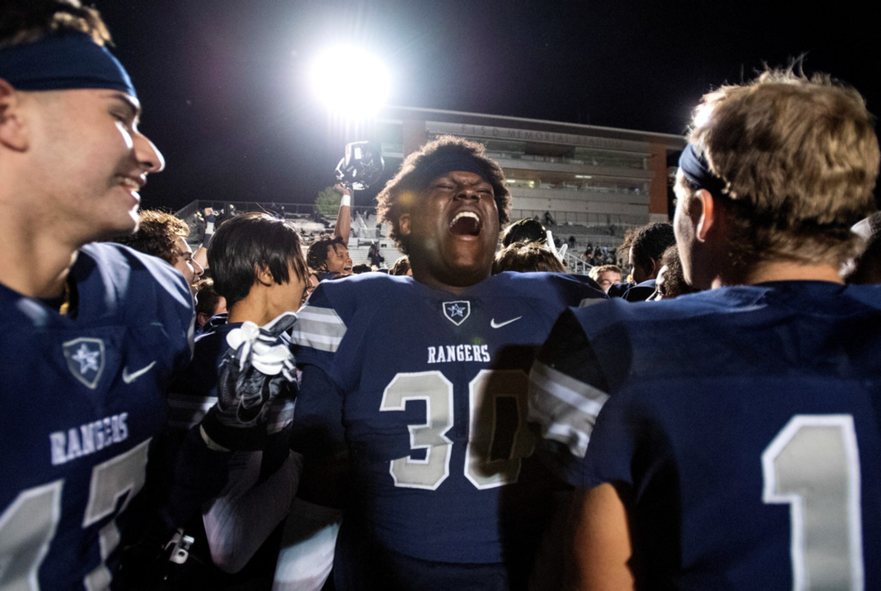 Frisco Lone Star junior defensive lineman Dylan Harris (30) celebrates with his teammates...