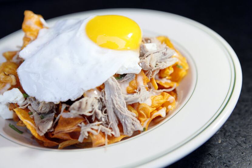 Sweet potato chip duck confit with a sunny side up duck egg from the restaurant Ida Claire,...