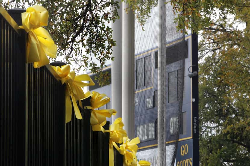 Yellow ribbons line the fence at Highlander Stadium in 2008.