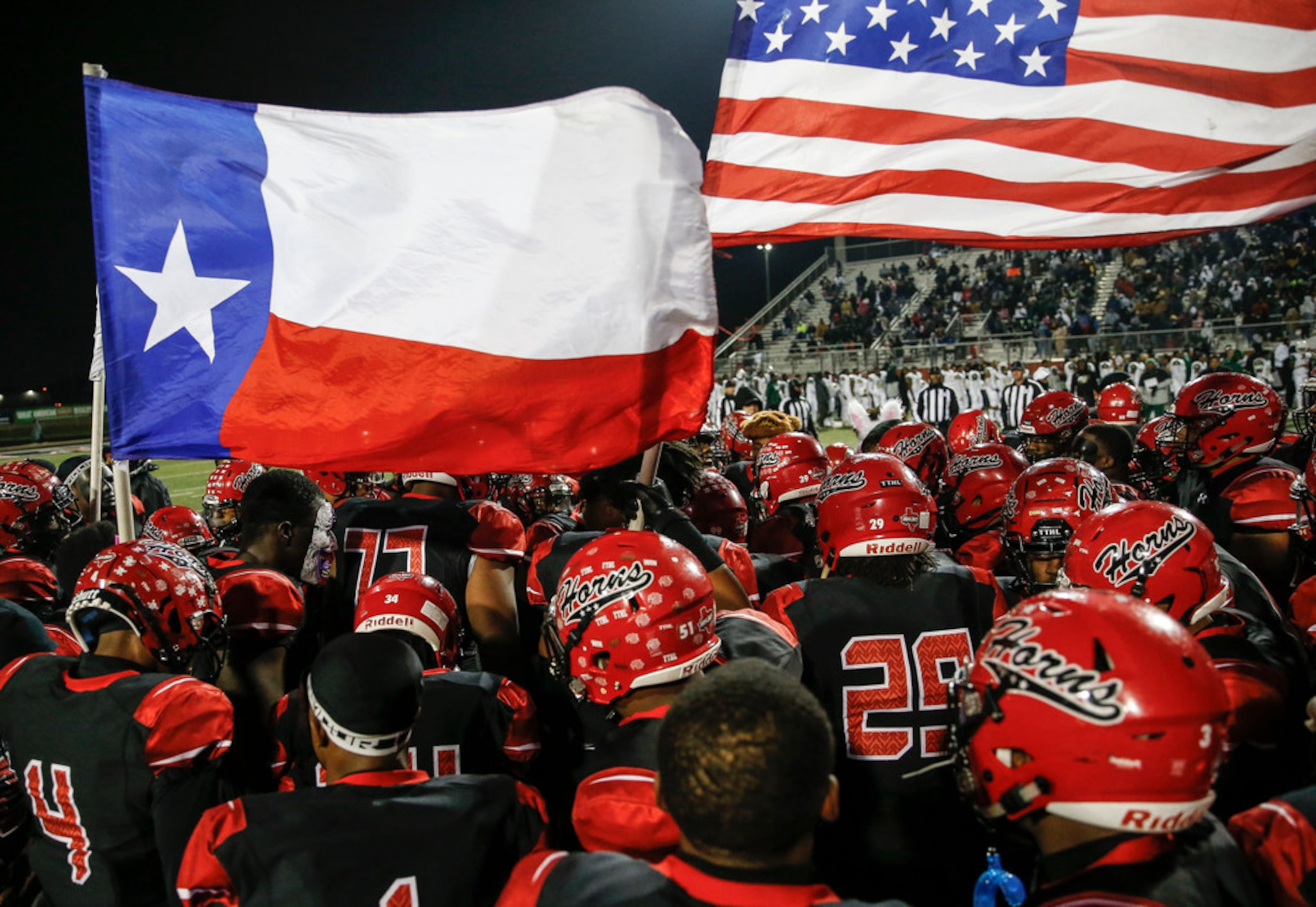 The Cedar Hill Longhorns gather prior to a high school football match up between Cedar Hill...