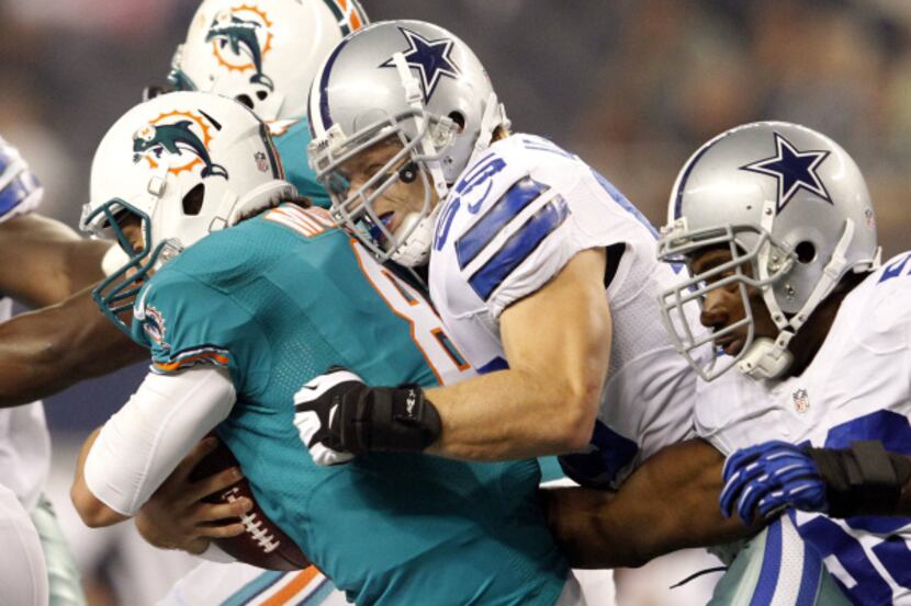 Dallas Cowboys linebacker Alex Albright (55) sacks Miami Dolphins quarterback Matt Moore (8)...