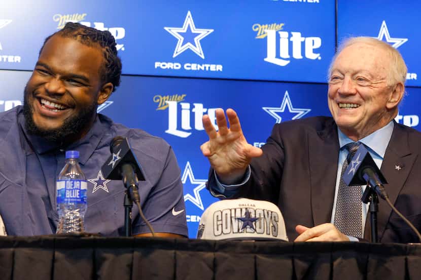 Dallas Cowboys rookie defensive tackle Mazi Smith (left) laughs alongside owner Jerry Jones...