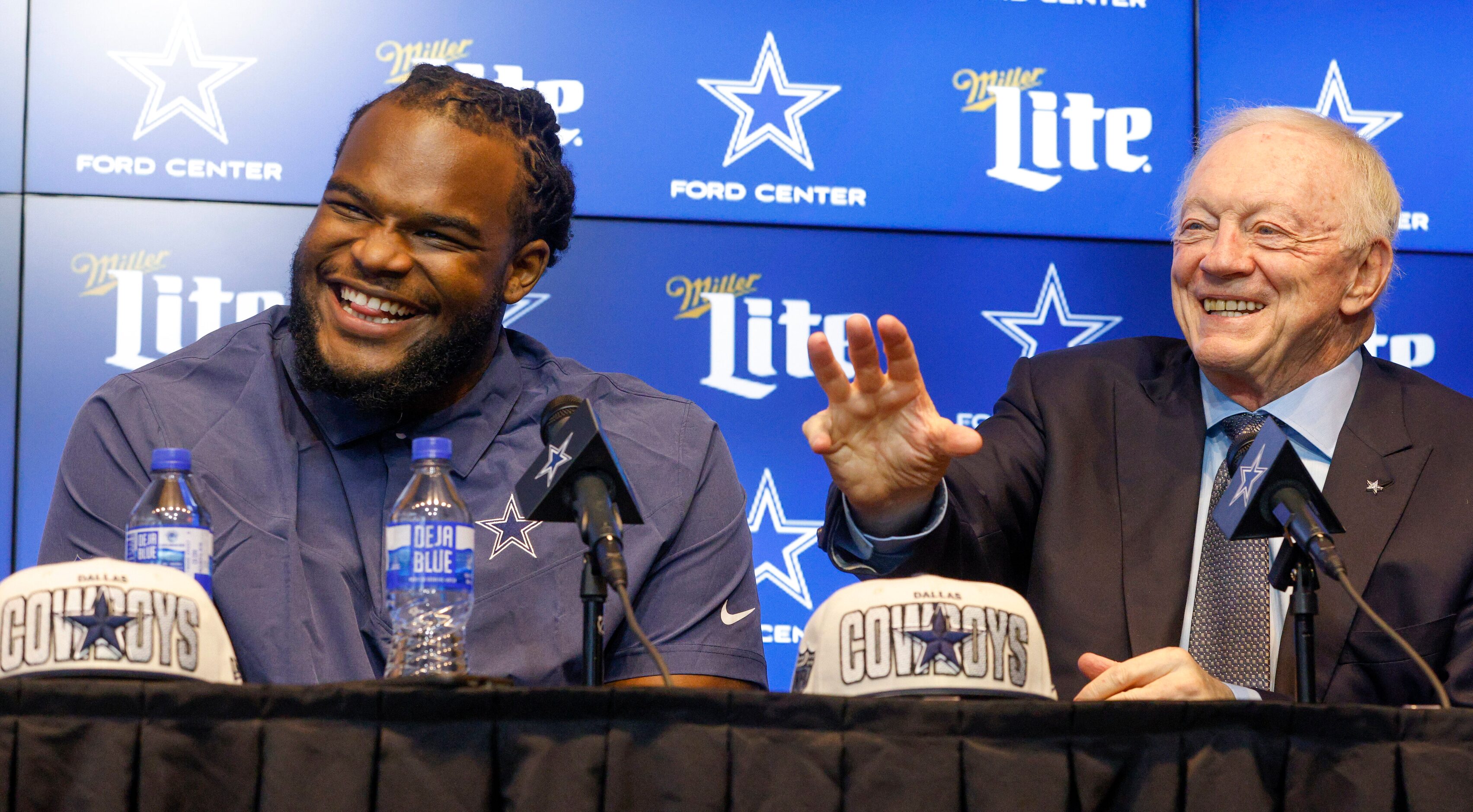 Dallas Cowboys rookie defensive tackle Mazi Smith (left) laughs alongside owner Jerry Jones...