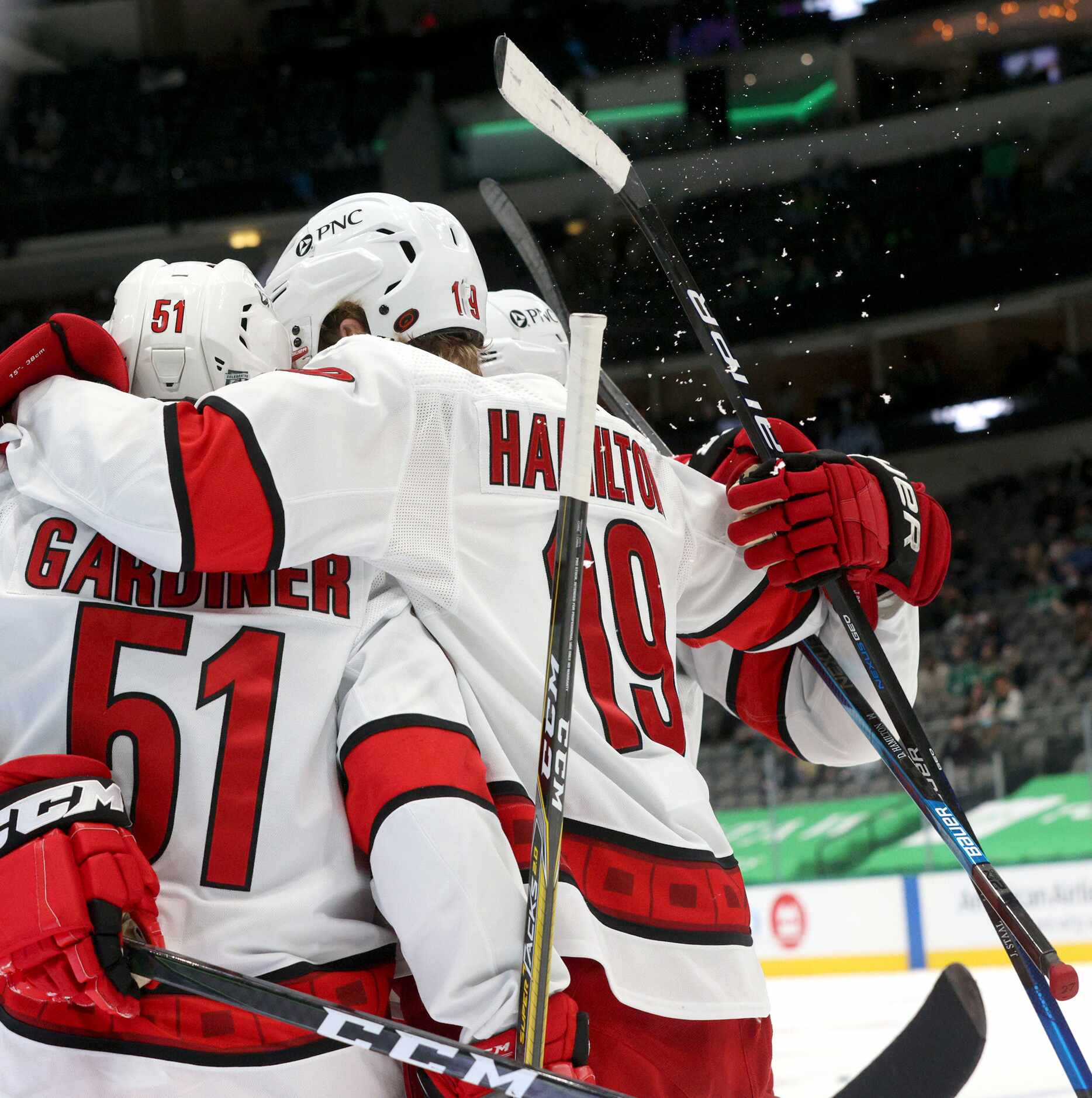 The Carolina Hurricanes celebrate after scoring during the second period of play in a game...