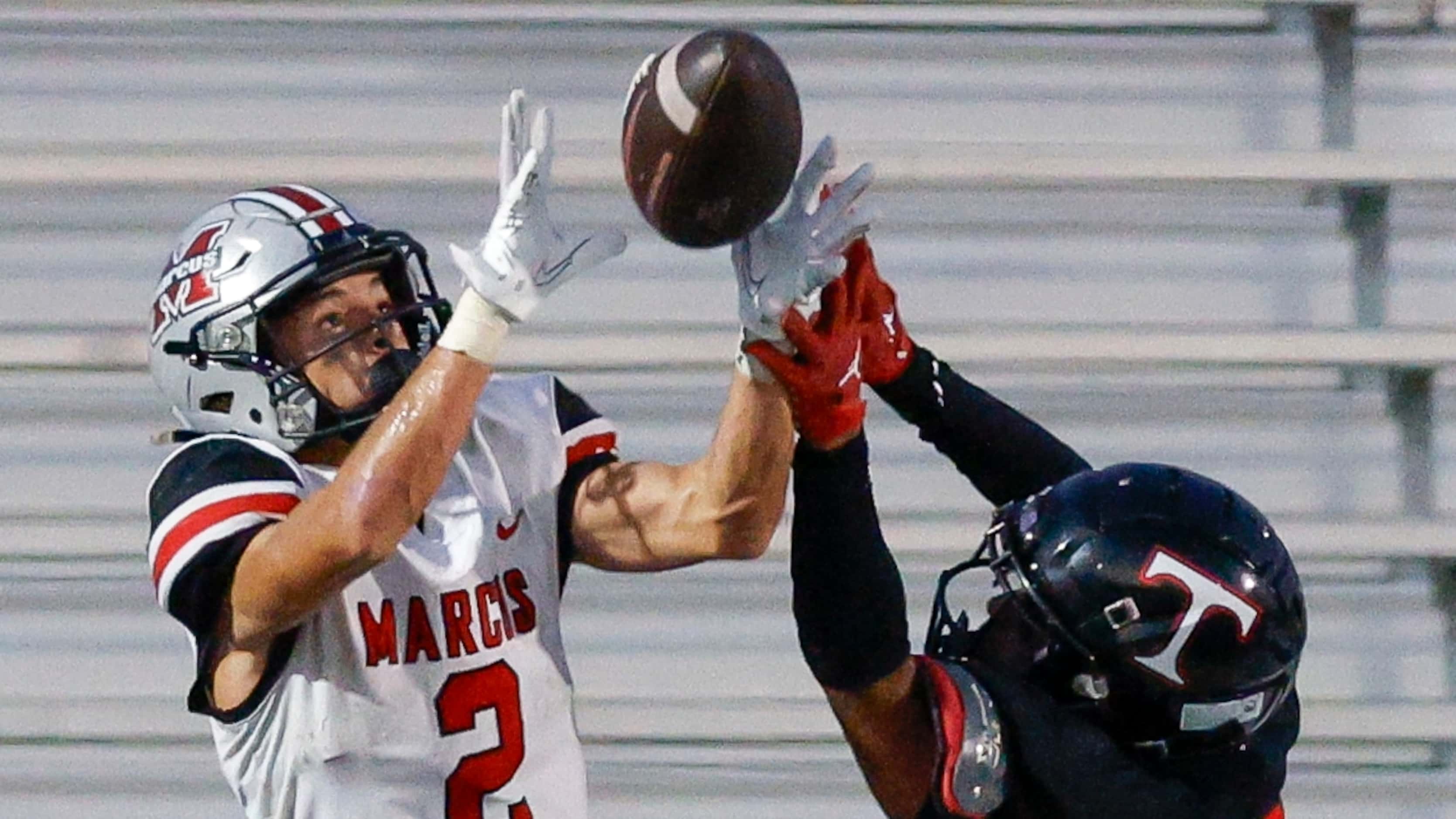 Flower Mound Marcus Karic Grennan (2) catches a pass over Euless Trinity linebacker DJ...