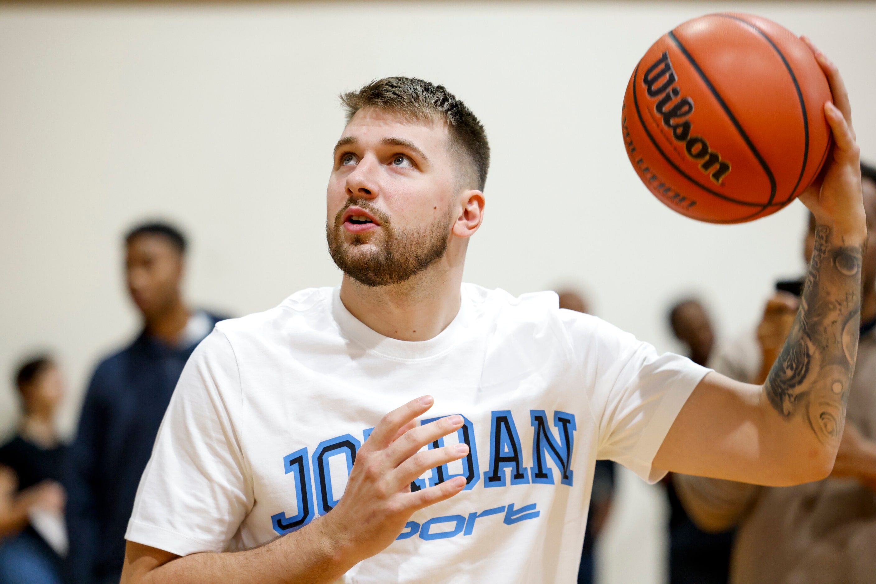 Dallas Mavericks guard Luka Doncic attempts a hook shot during a children’s basketball...