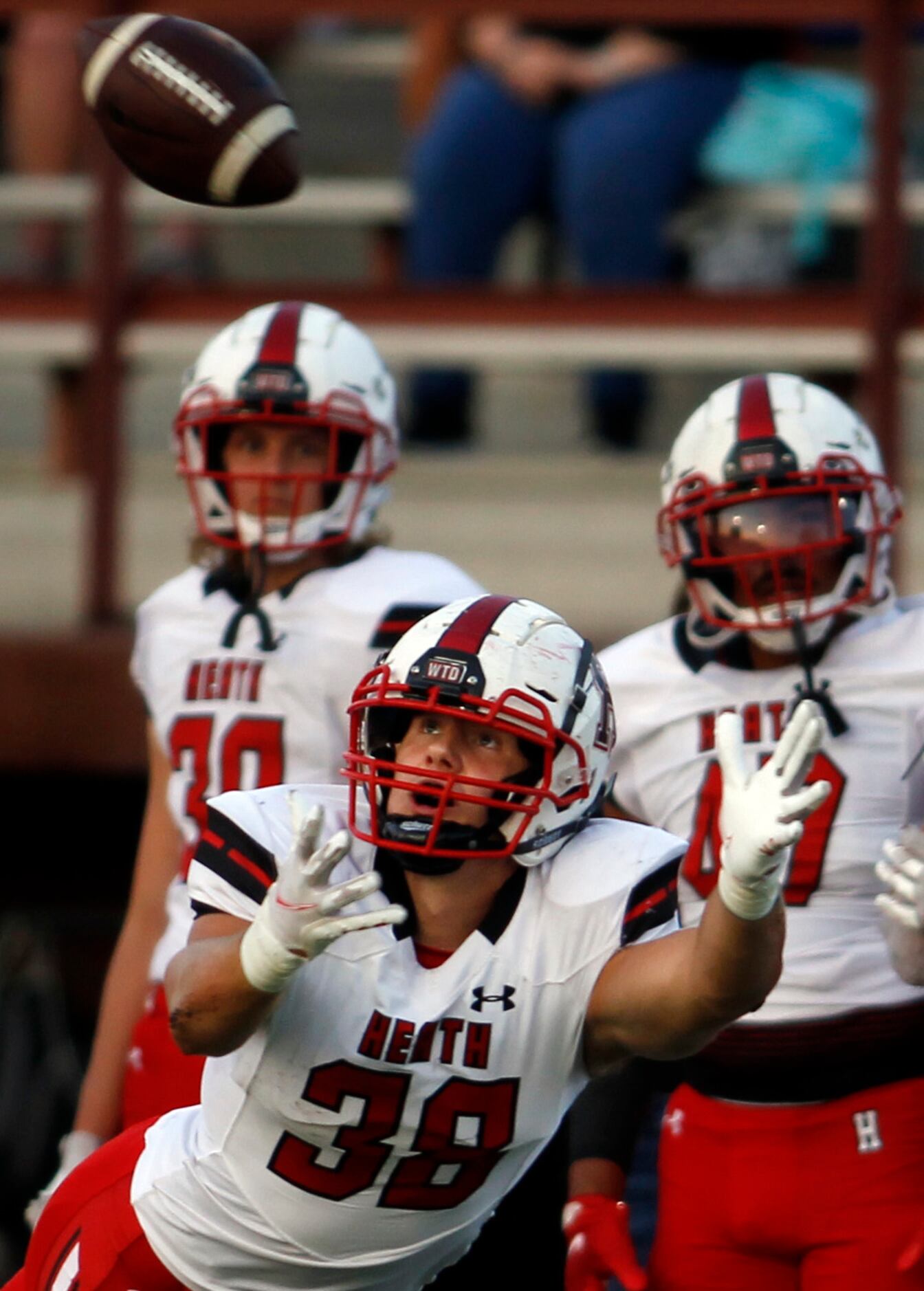 Rockwall Heath tight end Lance Mason (38) focuses on a long pass during first half action...