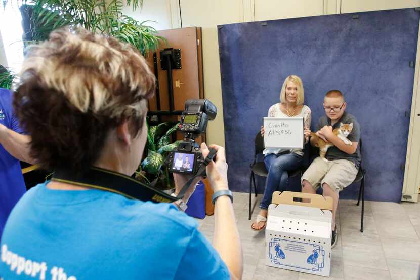 Bethany Cinotto and her son Kylen Kraus (10 years old) have their picture taken with their...